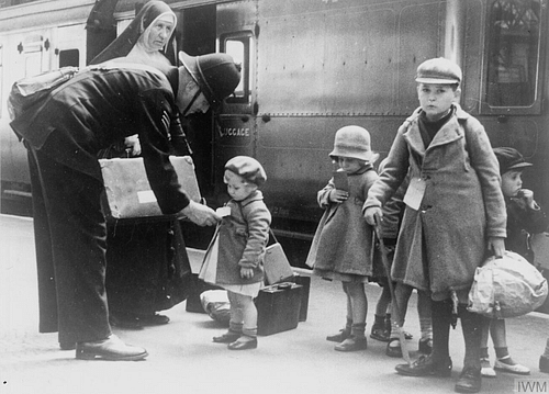 Policeman Helping Child Evacuees