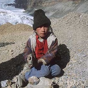 Thumbnail of photo of boy sitting on the ground