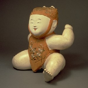The image is of "Child with Fox Mask; Gosho Doll" from the museum's collections.  It is a small, white porcelain figure of a child wearing a textile decorated with flowers.  A separate image of the doll on the site shows a fox mask for it to wear.