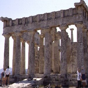 Image of the front of Aegina, Temple of Aphaia by Maria Daniels.  It shows the ruins of a Greek temple with the remaining columns standing.