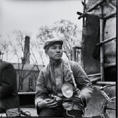 Photograph of Li Zhensheng with his camera in 1965