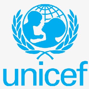 The image shows the UNICEF logo depicting in solid blue a parent holding a child in front of a sphere marked with latitude and longitude lines representing the globe.