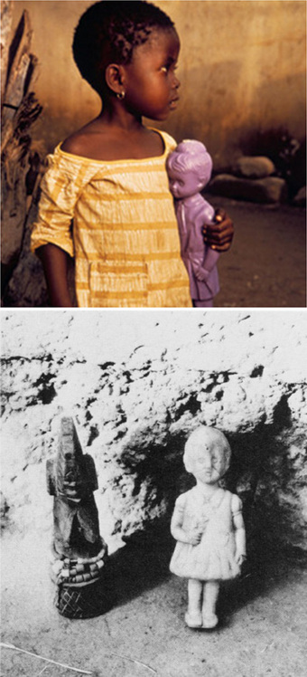 Photo of Asante girl holding plastic baby doll