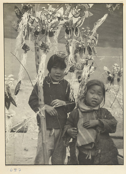 Two little girls with butterfly toys