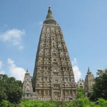 Image of the Mahabodhi Temple: a stepped pyramid with round dome-shaped structure (stupa) on top